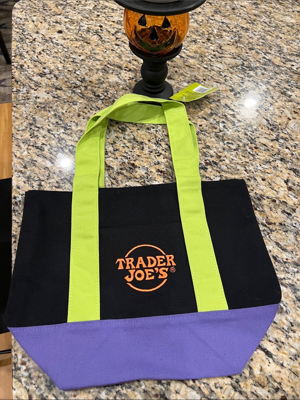 Trader Joe’s 2026 Black Canvas Tote with Lime Green Handles and purple base